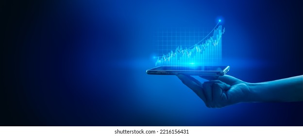 Businessman holding stock mobile phone and market economy graph statistic showing growth of profit analyzing financial exchange on blue background.Concept of growth planning and business strategy.