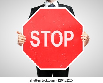 Businessman Holding A Stop Sign