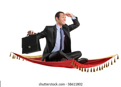 A businessman holding a suitcase while flying on a magic carpet - Powered by Shutterstock