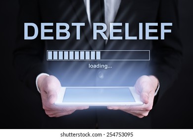 Businessman Holding A Tablet With Debt Relief Loading Bar  On The Screen. Internet Concept. Business Concept.