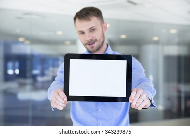 Businessman Holding Tablet In Hands