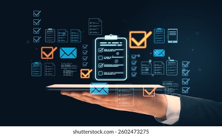 Businessman holding tablet with holographic digital document management icons, including checklists and emails, glowing on a dark background