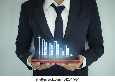 businessman holding tablet light graph, business concept , business idea concept