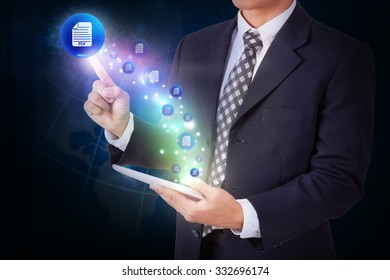 Businessman holding tablet with pressing mail pdf icon button. internet and networking concept