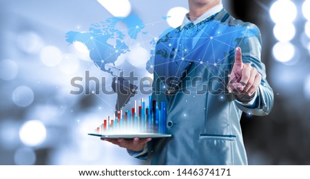 businessman holding tablet report on growth of business virtual chart and globalisation. business strategic planning conceptual.
