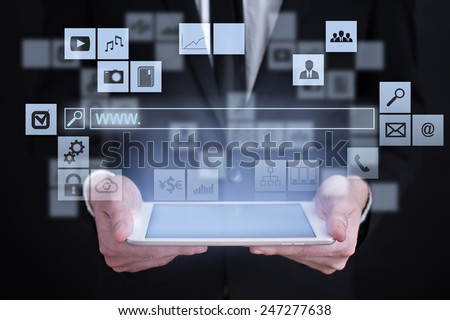 Businessman holding a tablet. with touch screen interface and search line. www surfing. internet concept.
