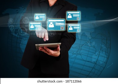Businessman holding a tablet with virtual  card and community icons. Concept of business communication. - Shutterstock ID 187112066