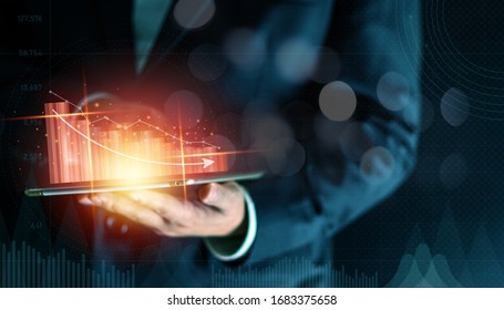 Businessman Holding Tablet With Virtual Dropped Financial Graph. Economic Collapse. Business Concept.