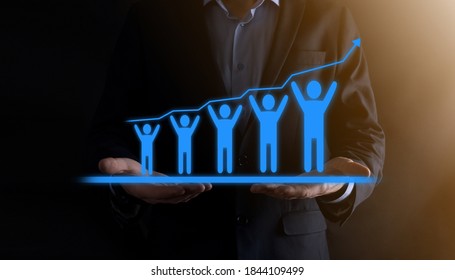 Businessman Holding A Team Of People, Workers, Holding A Growing Schedule,graph.upward Financial Arrow Up Teamwork Successful Business Development Growth Concept.teamwork Metaphor.