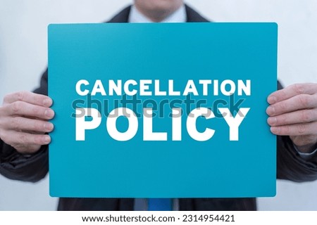 Businessman holding turquoise banner with inscription: CANCELLATION POLICY. Concept of business cancellation policy. Agreement Of Cancellation Policy.