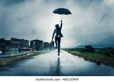 businessman are holding an umbrella