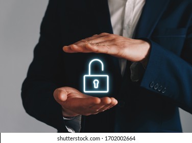 Businessman holding unlock icon symbol.
Concept of Unlock business, security, hacking and attack.
