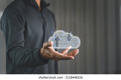 A Businessman holding virtual cloud computing to transfer data information and upload with download applications. Technology transformation concept. digital concept. 