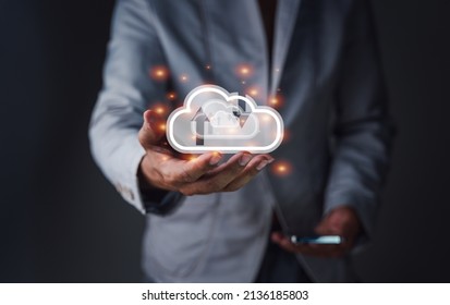 Businessman holding virtual cloud computing on hand with connection line. Cloud computing is a system for sharing download and upload big data information, business, and technology concept.