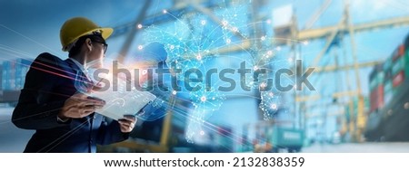Businessman holding virtual interface panel of global logistics network distribution and transportation on container cargo ship harbor Smart logistics, Industry, Innovation future of transport 