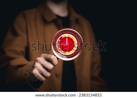 Businessman holding a watch Concept of service 24 hours a day, all week, product inspection The inspection is on time. punctuality People have 24 hours to work.