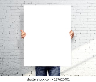 Businessman Holding White Blank Poster