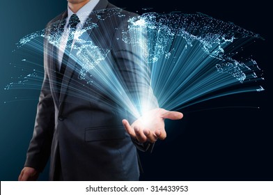 businessman holding world map made from glow line