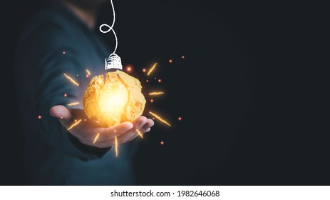 Businessman Holding Yellow Scrap Paper Ball With Illustration Painting For Virtual Lightbulb. It Is Creative Thinking Idea And Innovation Concept.