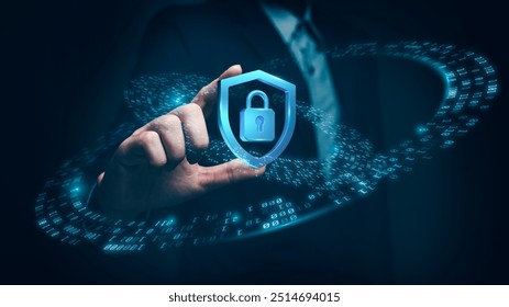 A businessman holds a glowing security shield with a lock icon, representing data protection, cybersecurity, and encrypted online systems. - Powered by Shutterstock