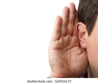 Businessman holds his hand near his ear and listening