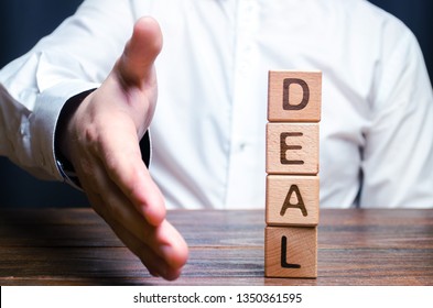 The Businessman Holds Out His Hand To Make A Deal. Concept Of A Contract Or Deal, Making An Offer. Signing Or Renewing A Contract. Come To Universal Consensus. Diplomatic And Political Success.