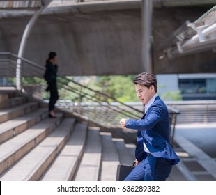 Businessman In A Hurry Checking Time And Running, He Is Late For Work His Business Appointment