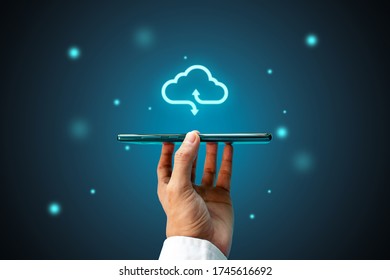 Businessman or information technologist with cloud computing icon and smart phone. cloud computing concept  - Shutterstock ID 1745616692