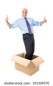 Businessman Inside Of A Cardboard Box