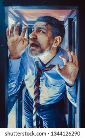 Businessman Inside Of Glass Box. Concept Of Captivity, No Freedom. Stressful Job, Pressure At Work. Lack Of Space, Office Worker. Emotional Distress, Claustrophobia.