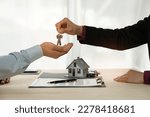 Businessman, insurance sales agent handing over house and car keys to customer in trading or renting in mutual agreement at security concept office housing investment.