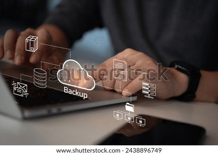 Businessman Interacting with a Backup Interface virtual cloud network data security system internet online with futuristic holographic digital technology.