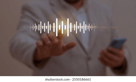 Businessman interacting with a glowing soundwave icon, symbolizing audio technology, voice recognition, and digital sound processing in modern applications. - Powered by Shutterstock