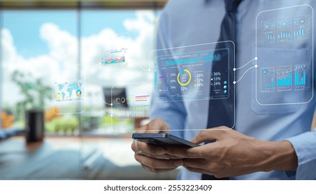 A businessman interacts with a smartphone displaying futuristic digital data visuals, highlighting statistics and analytics in a modern office environment. - Powered by Shutterstock