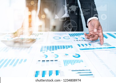 Businessman Investment Advisory Partner TEAM Analyzes Company's Annual Financial Statements. Balance Sheets Work With Graph Papers.  AUDIT TAX Analysis Concepts. Businessman with Documents Statistical - Shutterstock ID 1234808974