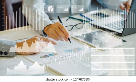 Businessman Investment Consultant Analyzing Company Financial Report Balance Sheet Statement Working With Digital Graphs. Concept Picture For Stock Market, Cash, Fund,and Business Economy Flow.