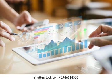 Businessman investment consultant analyzing company financial report balance statement working with digital augmented reality graphics. Concept for business, economy and marketing. 3D illustration.  - Shutterstock ID 1946814316