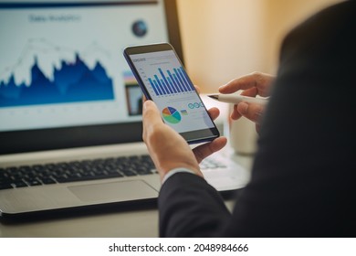 businessman investment consultant analyzing company annual financial report balance sheet statement working with documents graphs. Concept of economy, marketing and business corporation.