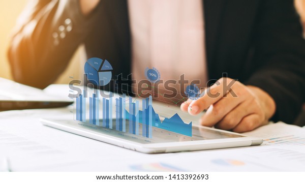 Businessman investment consultant analyzing\
company financial report balance statement working with digital\
augmented reality graphics. Concept for business, economy and\
marketing. 3D\
illustration.