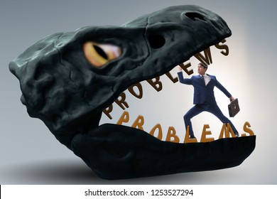 Businessman in the jaws of problems