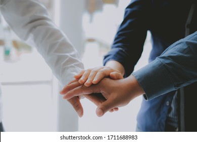 Businessman Joining United Hand, Business Team Touching Hands Together After Complete A Deal In Meeting. Unity Teamwork Partnership Corporate Concept.