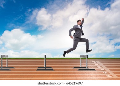 Businessman jumping over barriers in business concept - Powered by Shutterstock