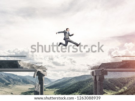 Businessman jumping over huge gap in concrete bridge as symbol of overcoming challenges. Skyscape and nature view on background. 3D rendering.