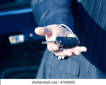 Businessman With Key And Car  For Buisness Travel