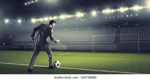 Businessman Kicking Ball