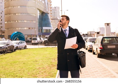 Businessman Kissing Phone, Laughing