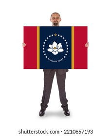 Businessman With A Large Message In His Hands - New Mississippi State Flag