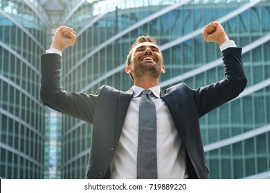 A Businessman Laughed With Open Arms And Smiling For Her Success In Working In The Economic And Financial Sphere. Concept Of: Success, Exultation, Business, Freedom.