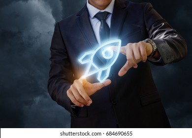 Businessman launches a missile . Start up project. - Shutterstock ID 684690655