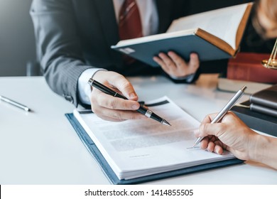 Businessman and lawyer discuss the contract document. Treaty of the law. Sign a contract business. - Shutterstock ID 1414855505